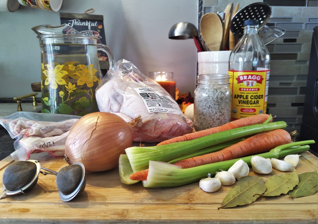 Homemade chicken stock from scratch ingredients 