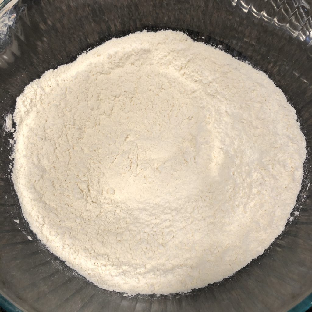 Flour and salt inside glass bowl