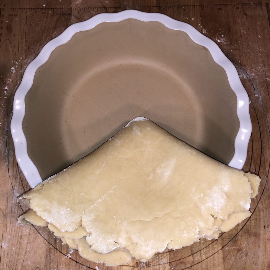 transferring einkorn lard pie crust to dish